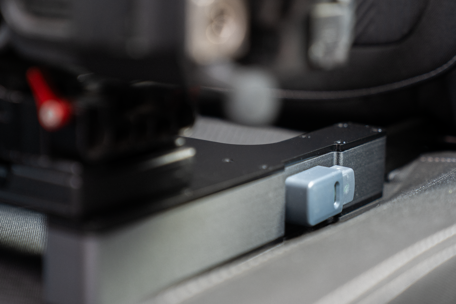 The Gearseat clicks securely into the universal ISOFIX/LATCH mount found in almost every modern car, giving you a rock-solid base for your camera gear.
